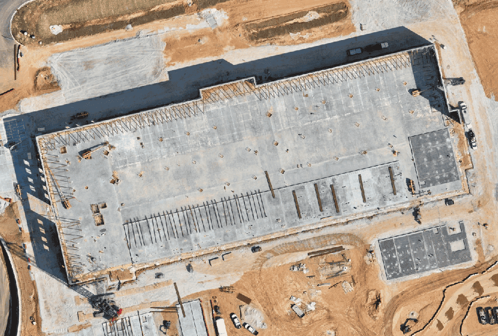 Construction site progress Day 2 - aerial satellite view showing daily evolution and timeline tracking for project monitoring